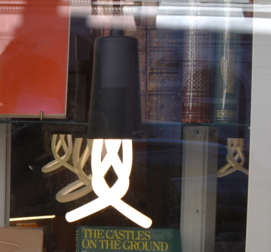 Plumen decorative CFL lamps - still in use
It's not often you see these lamps still in use, they were much more common around 2010-12 which is when they more or less first came onto the market. Even then, they were never too popular as they carried a fairly hefty price tag! These particular examples were spotted in the window of a second-hand bookshop in York.
