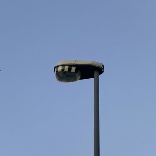 Urbis ZX3 Zebra
Installed sometime between 2011 and 2012. This lantern features a white canopy and a zebra optic to direct the light towards the crossing and reduce glare from oncoming vehicles. This is running 45w Cosmo.
