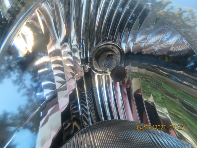 Philips H4 55W halogen lamp inside the headlight of my father Mazda 2 2009
I don't know if the other headlight have it as well or it have other brand.
