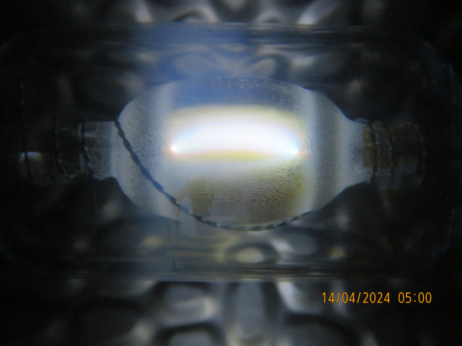 The arc of my Osram HQI-TS 70W/D through my new ND1000 filter
You can see the multi color arc inside.
Here is a closeup video of the arc during run-up:
[url]https://www.youtube.com/watch?v=8eSfAHedbI4[/url]

Better and higher resolution of the arc:
[img]https://i.postimg.cc/Twqqy9rG/IMG-8030.jpg[/img]

See whats happening when I put the lamp so that the halides are at the top:
[url]https://www.youtube.com/watch?v=HUFEPtuhfmk[/url]
