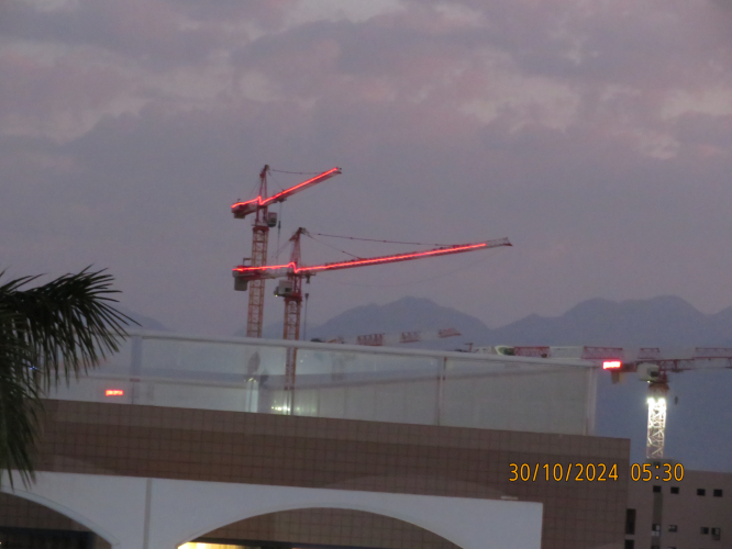 Decorative pilot warning lights on cranes as seen from my room
I don't know what they plan to build.
