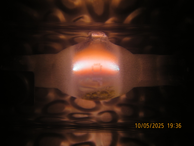 The arc of my BLV HIT-DE 70W "Orange" MH lamp currently
There is more sodium and less mercury in the arc, but the colour is still warm pink, and not close to orange.
