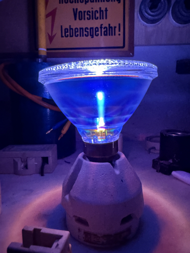 Philips Westinghouse C70S62/PAR/M moments after striking 
The lap uploaded previous immeaditly after ignition. Quite cool color with that dichroic reflector of that lamp. 
