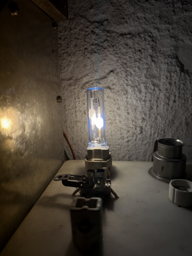 2022 Aura Crystal-TL LL 70W/942 Twinarc CMH --Well meant, is not well done--
Here you can see a fairly late 2022 twinarc CMH lamp sold by Aura Sweden. The Idea is fairly simple, two arc tubes=Twice the lamp life. The life is claimed to be 43.000hrs up to 50% failure rate.
In my opinion however, especially this lamp is well meant however not well executed. 
1) The lamp is fiscally notably longer then a standard CMH lamps which may be a problem in tight fittings
2) The arc tubes are off center to any common optic which is engineered for a single arc tube
3) The failure mechanism of CMH lamps is a leaking arc tube which will lead to severe blackening of the outer envelope
4) Immediate hot restrique is not possible as the second arc tube is so close to the operating that it gets to warm

The lamp does not state were it was made. It can be either be made by Narva in Berlin or sourced from China...
