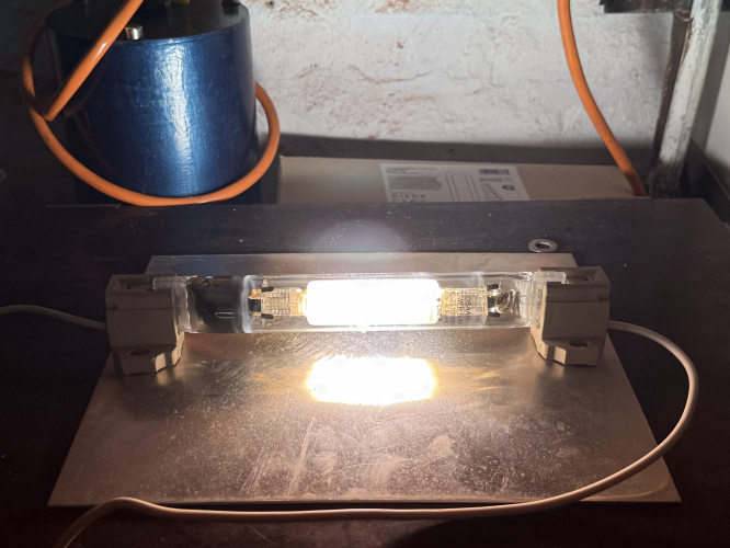 1983 Osram Power Star HQI-TS 1000W/D
The biggest version of Osram series of FC2 based instant restart metal halide lamp. The HQI-TS Series of lamp was launched in 1970 with the 400W Model. Later a 250W and this 1000W lamp were added, as well as 240W and 400W NAV-TS lamps. 

These lamps are made of quartz and give of a nice ozone smell when staring. Obviously extremely bright. 
